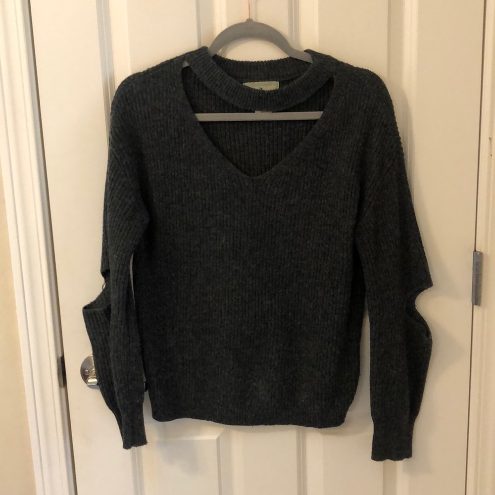 Open neck sweater with elbow slits